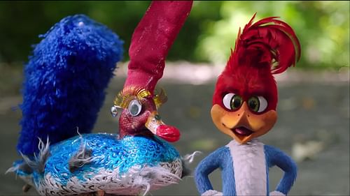 Woody Woodpecker stands next to a colorful decoy used by the poachers in the 2017 movie, showcasing one of his clever encounters in the forest. (Image via Amazon Prime)