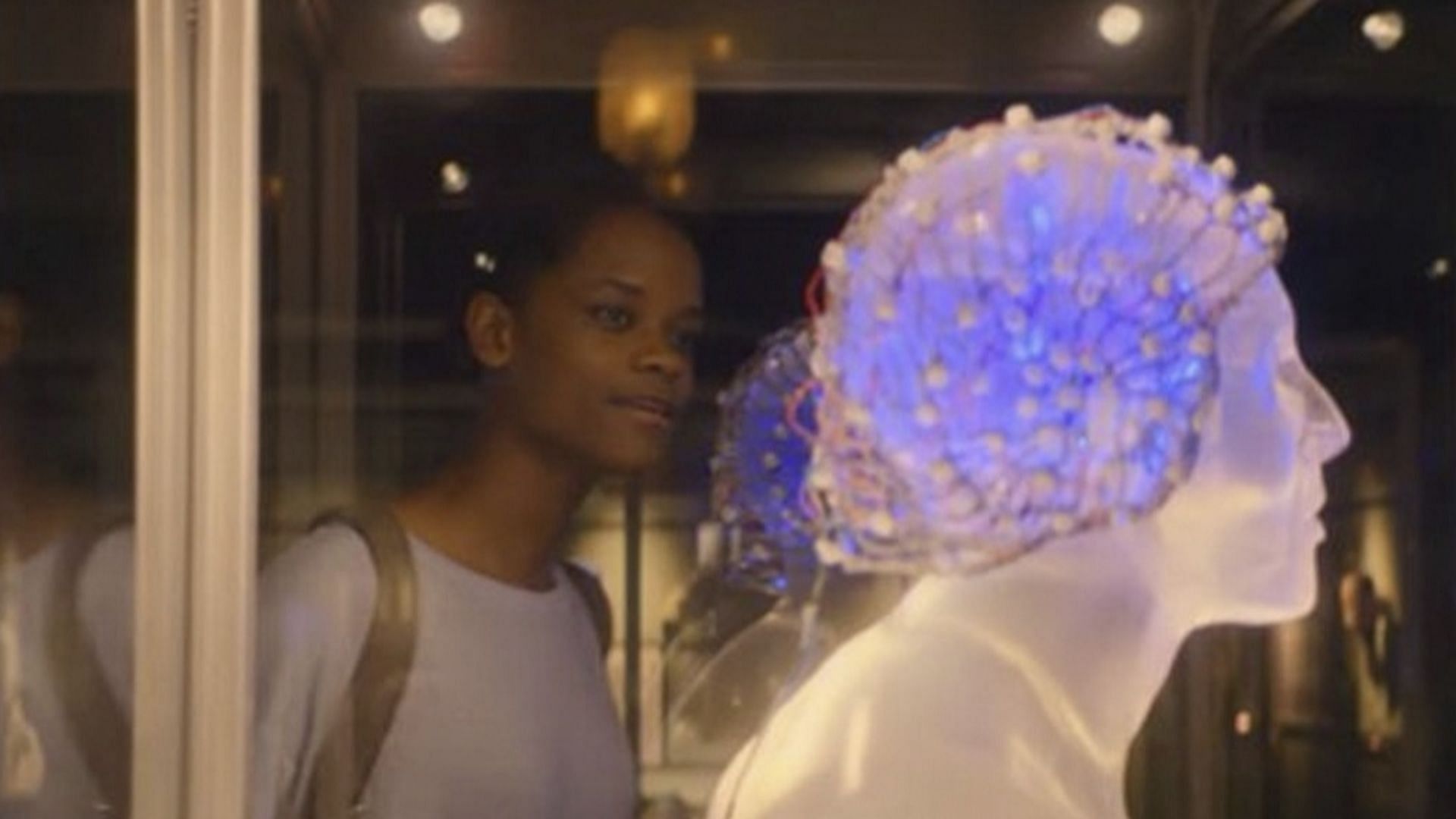 Rolo guides Nish through a museum of sinister tech relics, each with a dark story (Image via Netflix)
