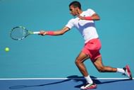 Félix Auger-Aliassime returns a shot against Tristan Schoolkate of Australia during their match on Day 4 at Hard Rock Stadium on March 21, 2025, in Miami Gardens - Source: Getty