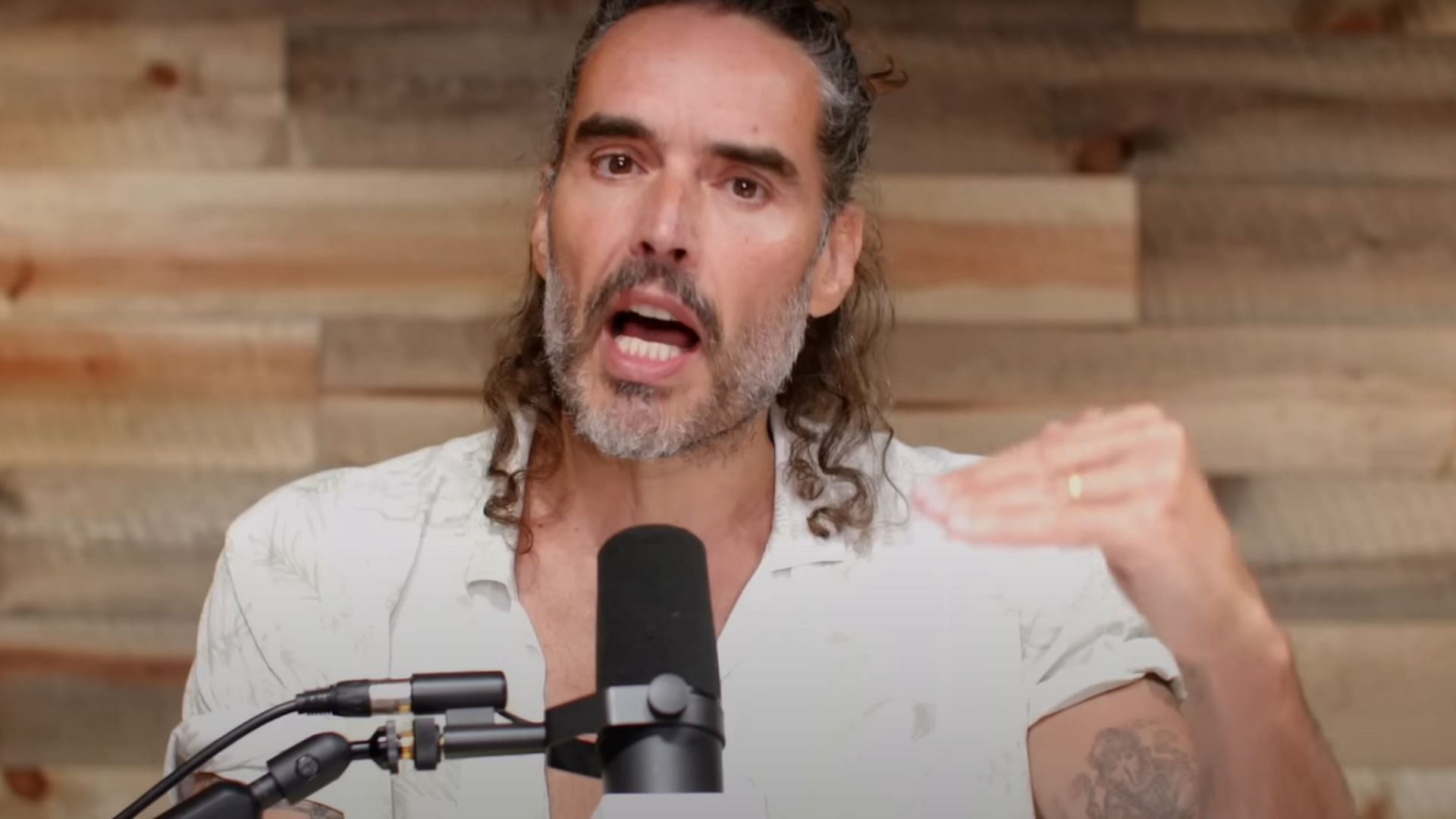 Russell Brand offering commentary in Stay Free With Russell Brand(Image via YouTube/@RussellBrand)