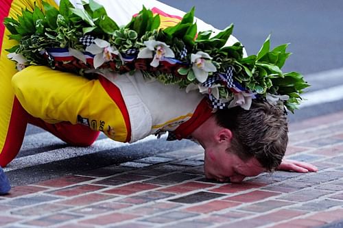 Josef Newgarden kissing the iconic bricks at the Indianapolis Motor Speedway after winning the 2024 Indy 500- Source: Getty