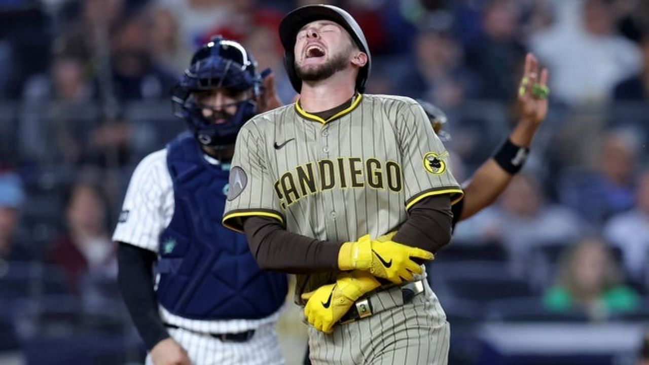 Jackson Merrill reacts after taking a hit from Devin Williams&rsquo; fastball.[Source: Imagn]