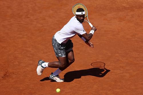 Tiafoe plays a backhand slice in the Italian Open 2025 - Day Six - Source: Getty