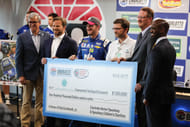 Charlotte Motor Speedway president Marcus Smith presents a check to Dale Earnhardt Jr. Foundation for Concussion Research during the 2017 Bank of American 500. Source: Imagn