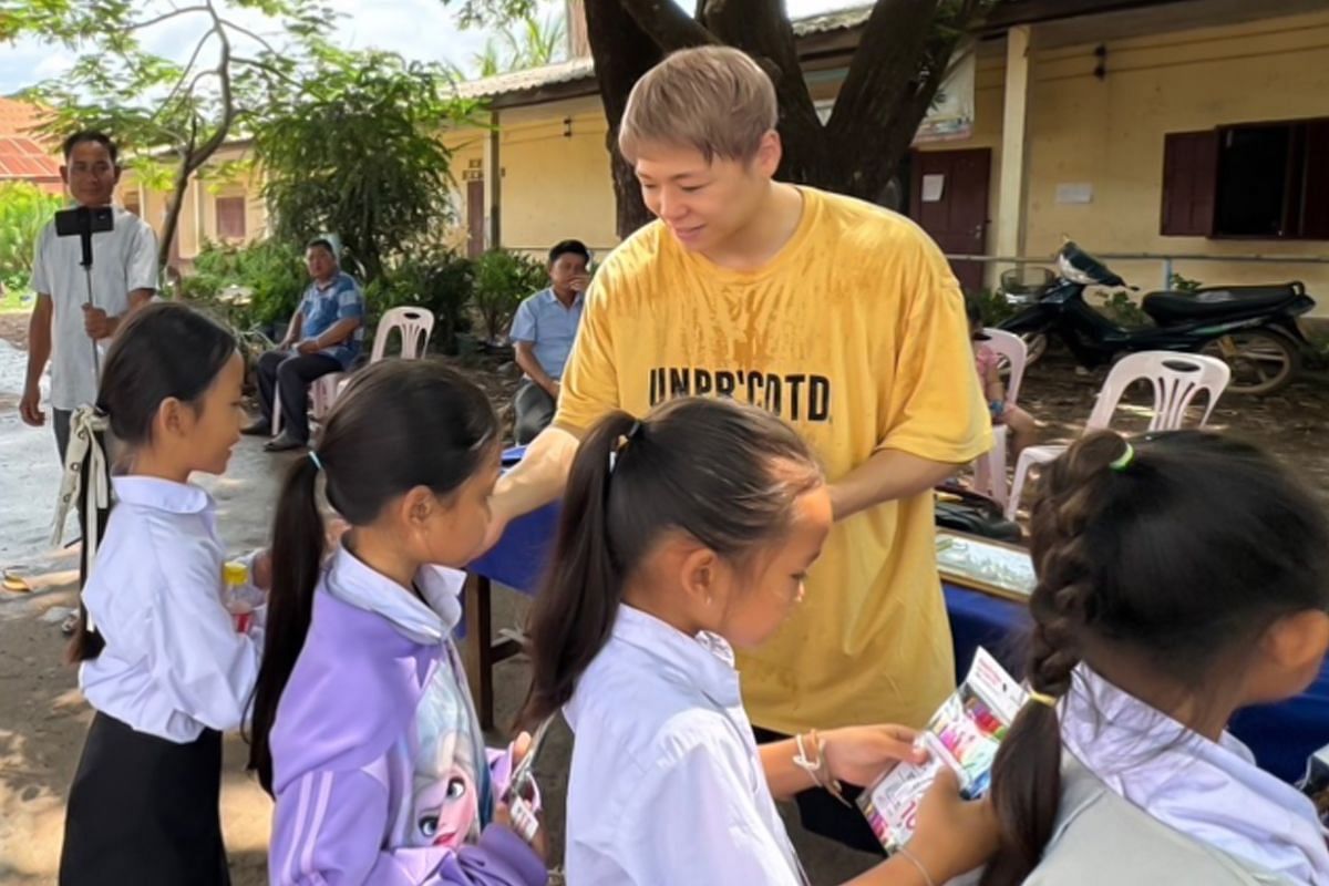 Takeru Segawa heads a donation drive in Laos. [Photo from Takeru