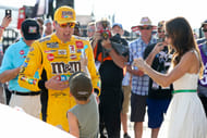Kyle Busch celebrates with wife Samantha and son Brexton at Pocono Raceway. Source: Imagn
