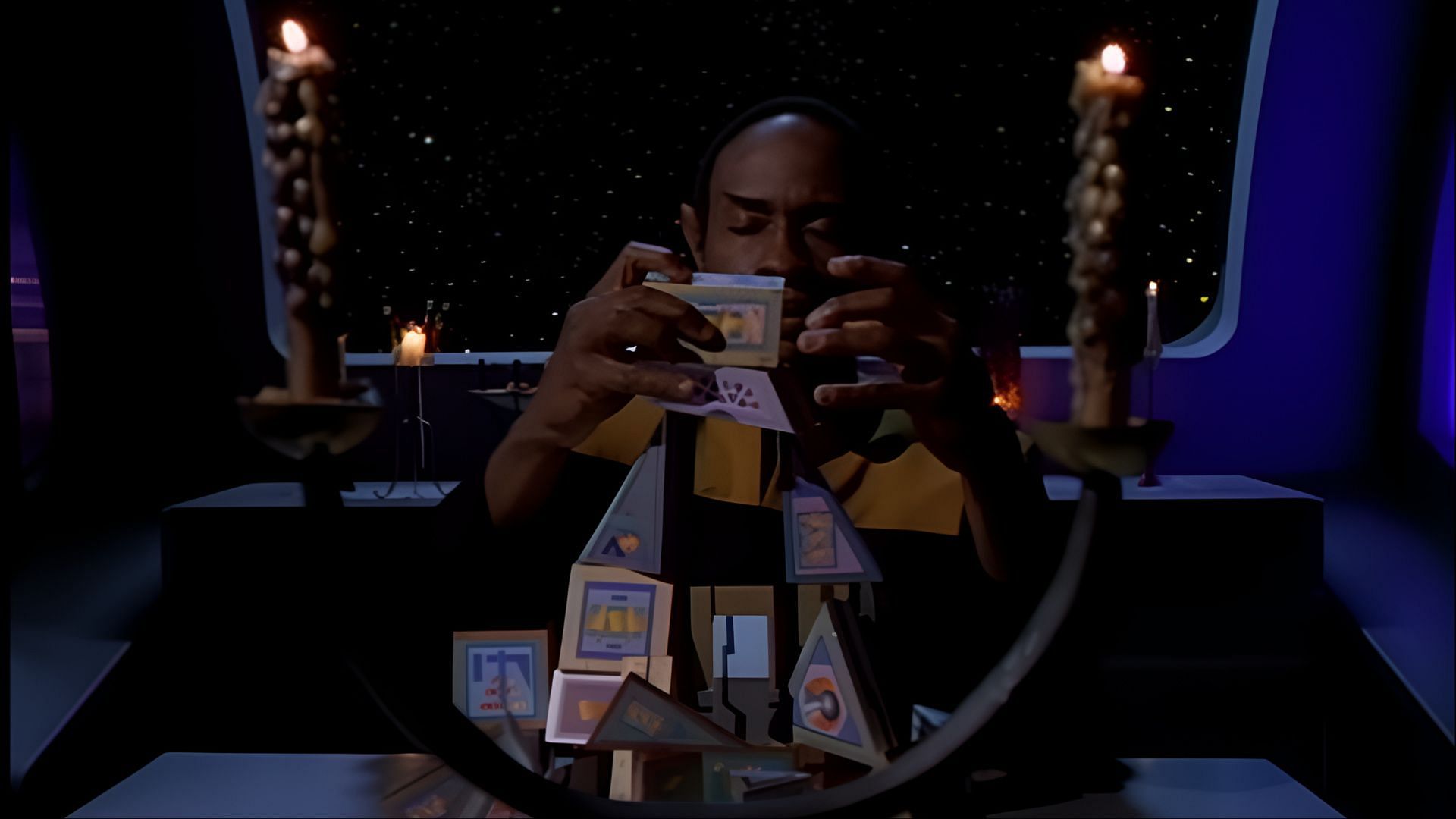 In a quiet room lit only by flickering candles, Tuvok struggles to keep his structure of a puzzle steady, mirroring his internal discipline in Star Trek: Voyager. (Image via Netflix)
