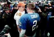 Kentucky's Tim Couch, here shaking hands with Arch Manning's uncle, Peyton Manning, had a massive hype following when he came to Kentucky. (Photo Credit: IMAGN)