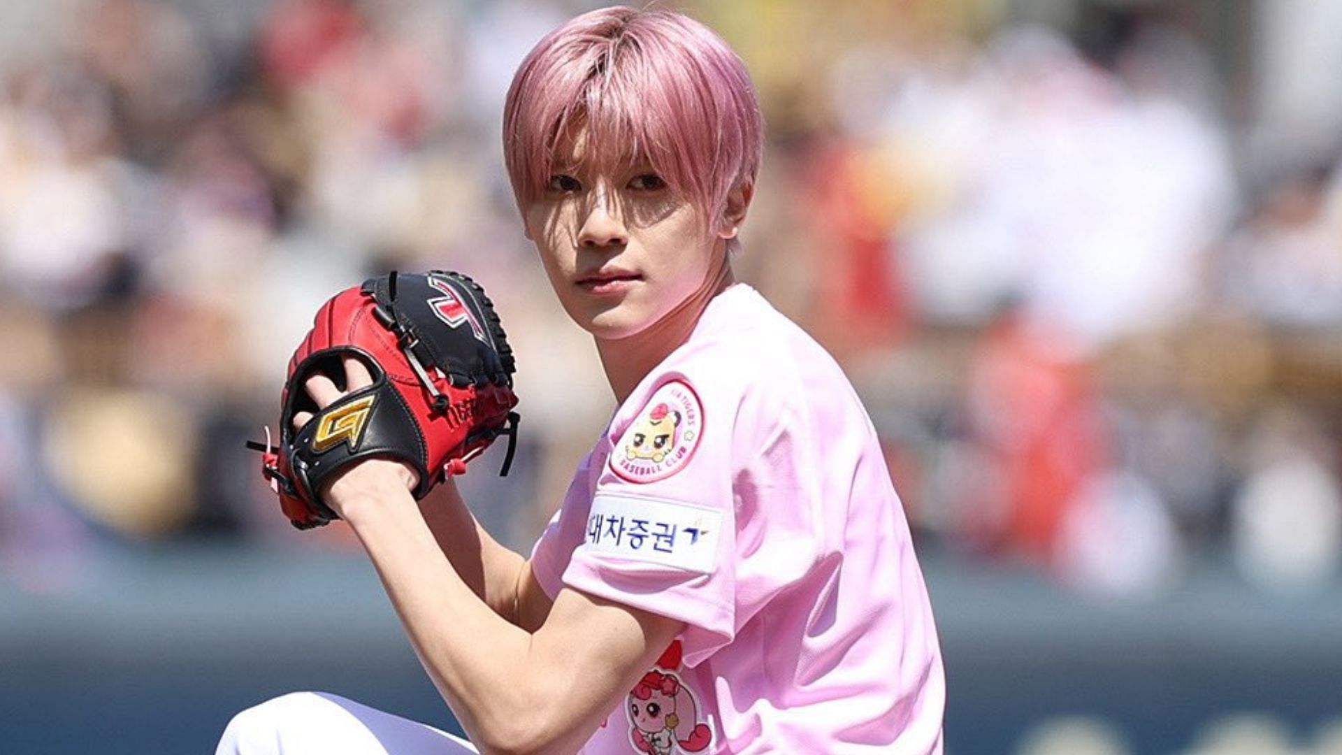 NCT WISH member Sion throwing the first pitch at KIA Tigers