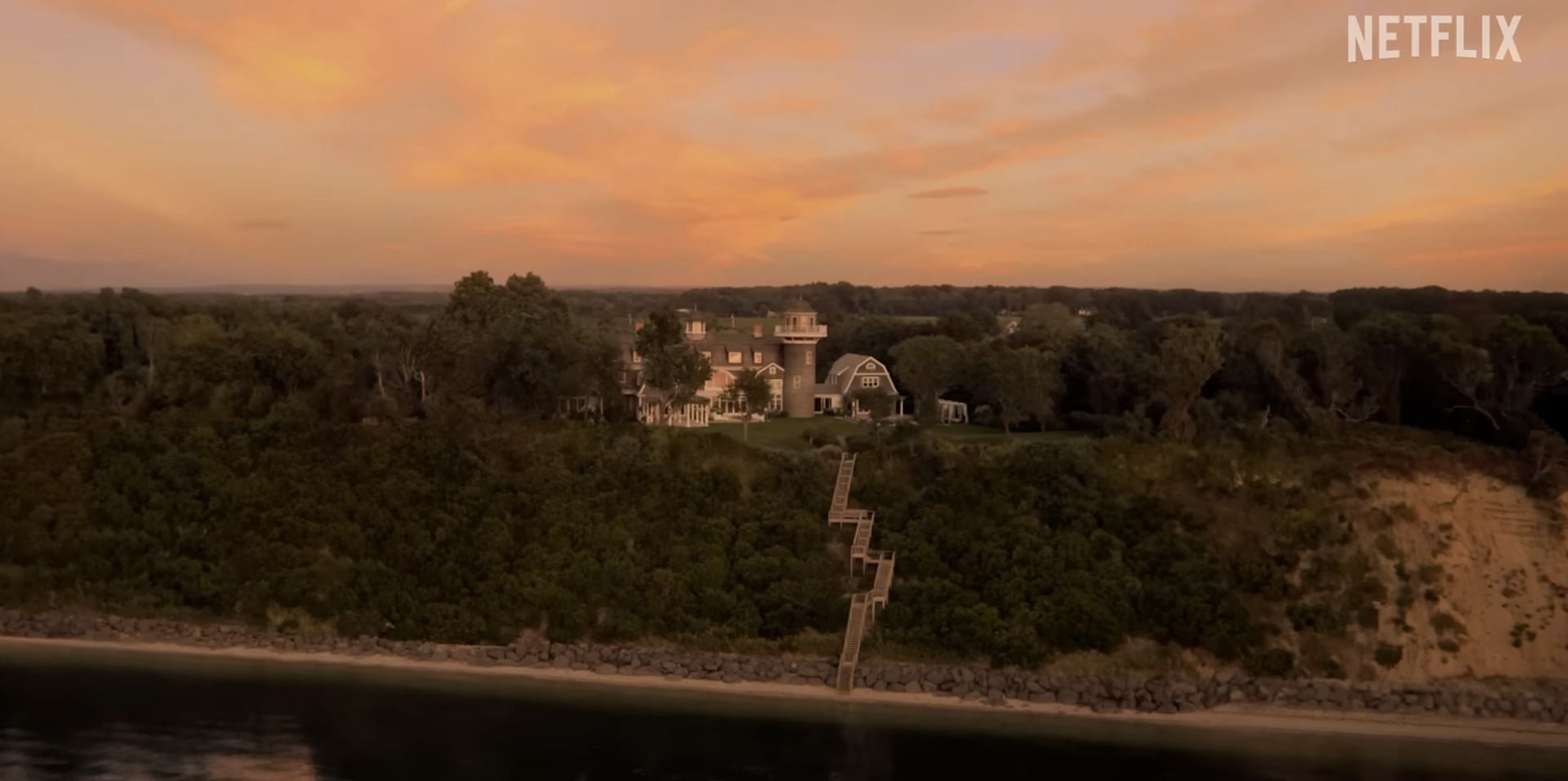 Ethan slips and falls off the cliff outside the Kells&#039; manor. (Image via Netflix/YouTube)