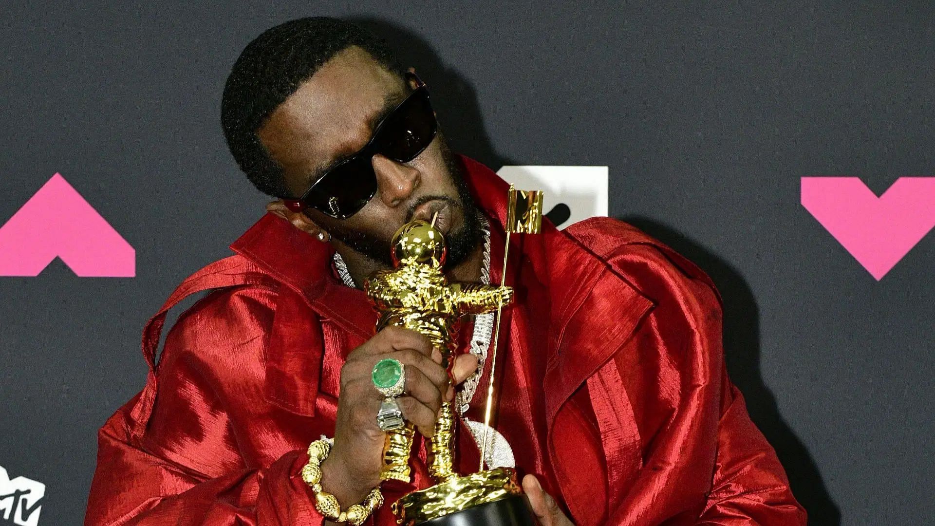 Sean &ldquo;Diddy&rdquo; Combs poses with the &quot;Global Icon Award&quot; in the press room at the 2023 MTV Video Music Awards (Image via Getty)
