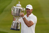 Brooks Koepka lifts the PGA Championship Trophy - Image Source: Imagn