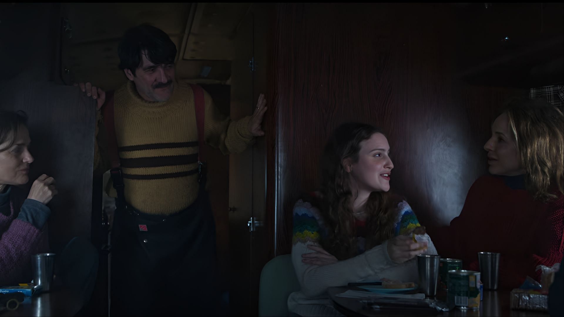 A moment of connection amidst chaos in The Eternaut season 1, featuring Elena, Clara, and Favalli as they navigate the uncertainty of a collapsing world. (Image via Netflix)