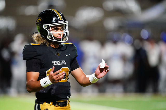 Oct 20, 2023; Carrollton, GA, USA; Carrollton Trojans quarterback Julian Lewis (10) reacts to a play against the Westlake Lions during the first half at Grisham Stadium. The 15-year-old Carrollton High student has already committed to playing for the University of Southern California Trojans and has been considered one of the top high school quarterback prospects. Mandatory Credit: John David Mercer-Imagn Images - Source: Imagn