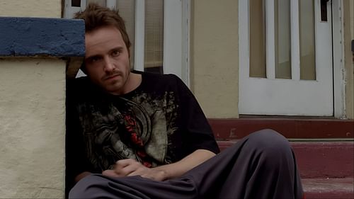 After Jane’s death, Jesse sits alone, lost, silent, and broken. This still moment captures the quiet descent that made Breaking Bad more than just a crime drama. (Image via Netflix)