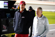 Joey Logano and Jeff Burton walking together at Daytona - Source: Imagn