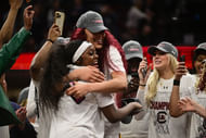 South Carolina Gamecocks center Kamilla Cardoso (#10) reacts with guard Raven Johnson (#25) during the trophy presentation after they defeated the Iowa Hawkeyes in the finals of the 2024 NCAA Tournament at Rocket Mortgage FieldHouse. Photo: Imagn