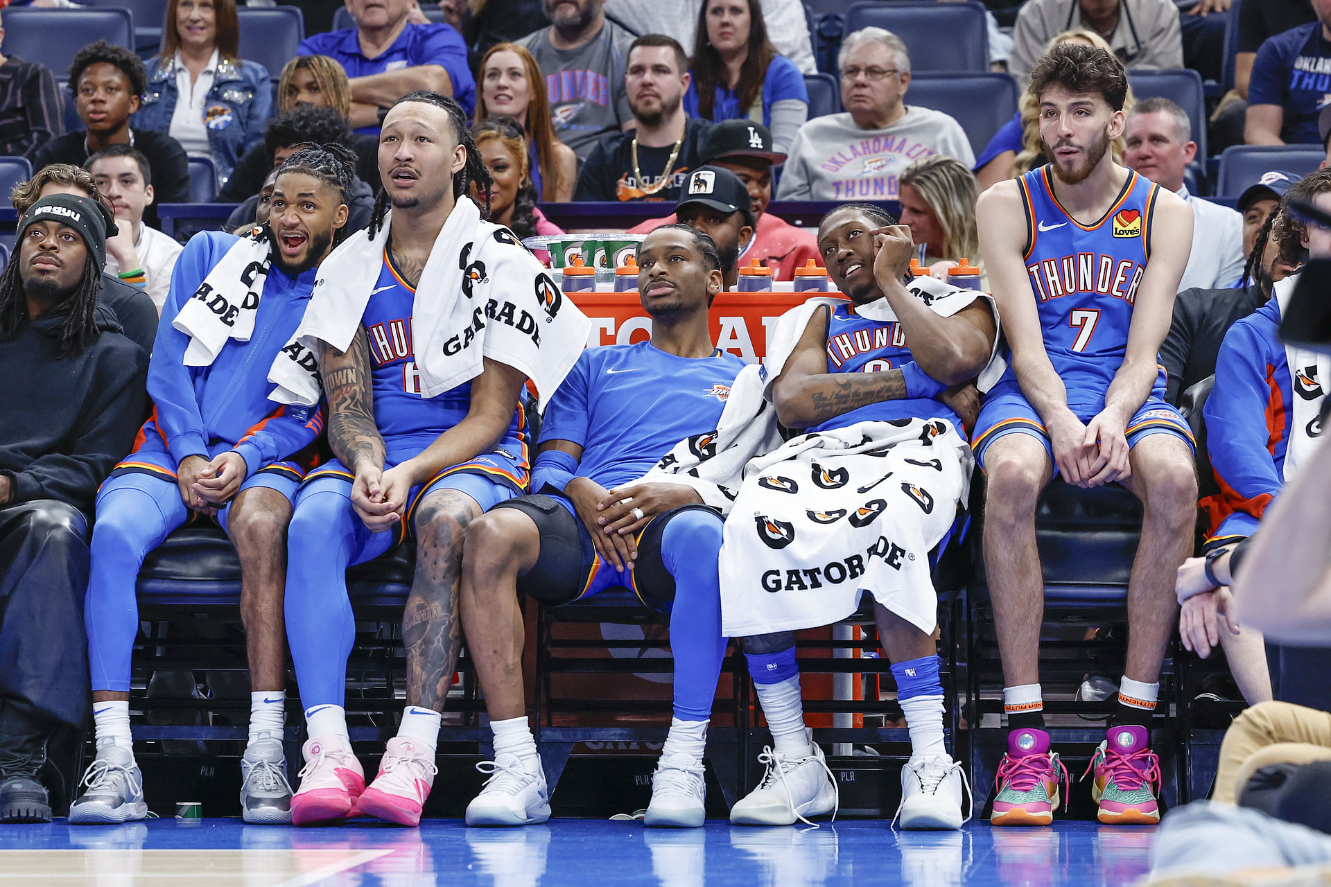 Apr 10, 2024; Oklahoma City, Oklahoma, USA; (L-R) Oklahoma City Thunder guard Isaiah Joe (11) and forward Jaylin Williams (6) and guard Shai Gilgeous-Alexander (2) and forward Jalen Williams (8) and forward Chet Holmgren (7) watch their team play against the San Antonio Spurs during the second half at Paycom Center. Mandatory Credit: Alonzo Adams-Imagn Images - Source: Imagn