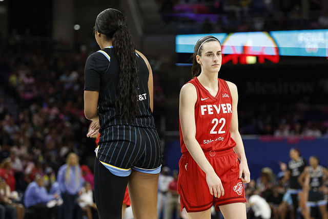Aug 30, 2024; Chicago, Illinois, USA; Indiana Fever guard Caitlin Clark (22) walks by Chicago Sky forward Angel Reese (5) during the second half at Wintrust Arena. Mandatory Credit: Kamil Krzaczynski-Imagn Images - Source: Imagn