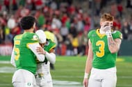 Oregon quarterback Moore, left, defensive back Brandon Johnson and tight end Terrance Ferguson walk off the field - Source: Imagn