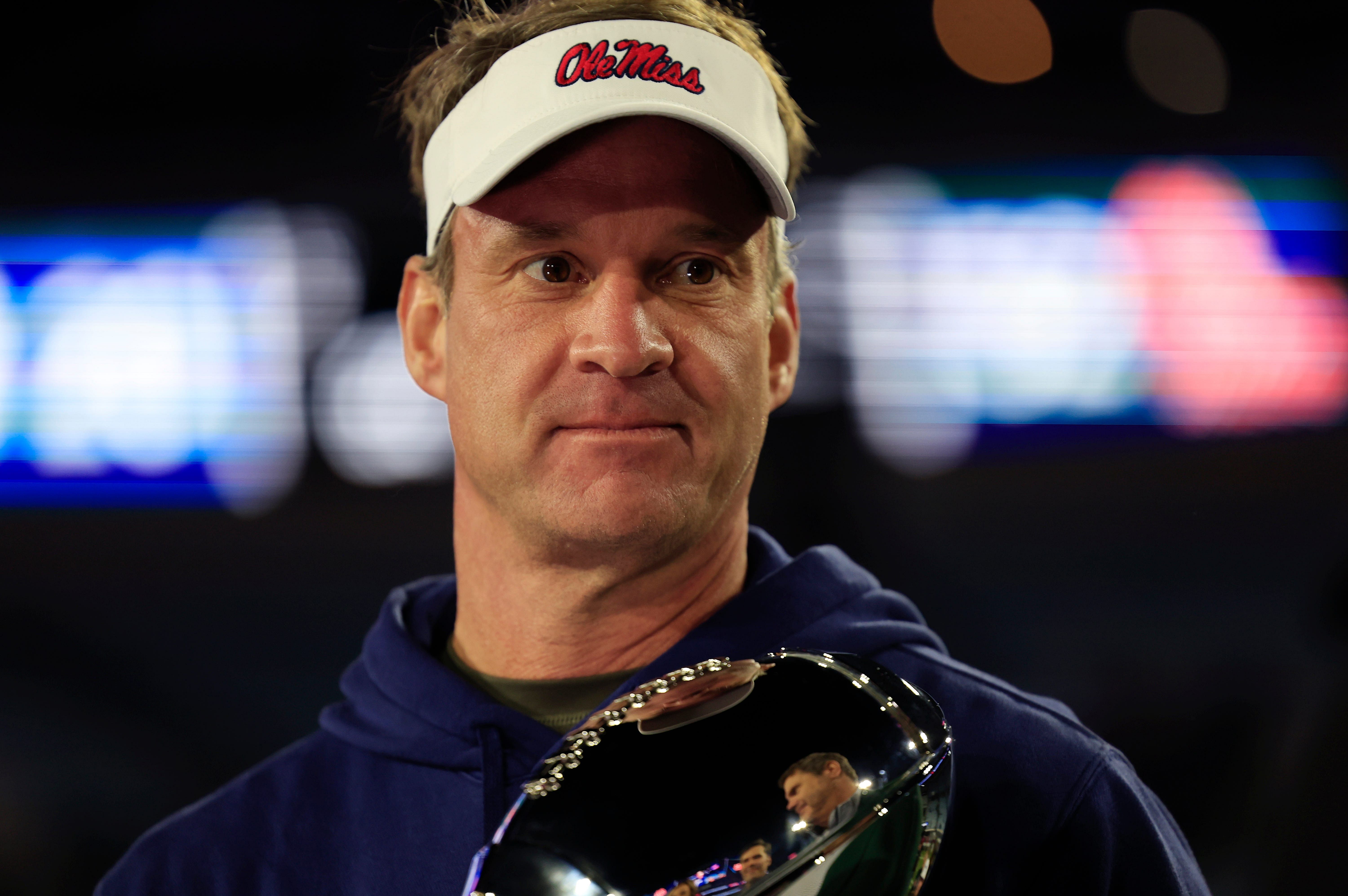 Mississippi Rebels head coach Lane Kiffin is interviewed after the game while holding the Ash Verlander Champions Trophy of the TaxSlayer Gator Bowl Thursday, Jan. 2, 2025 at EverBank Stadium in Jacksonville, Fla. Ole Miss defeated Duke 52-20. [Corey Perrine/Florida Times-Union] - Source: Imagn