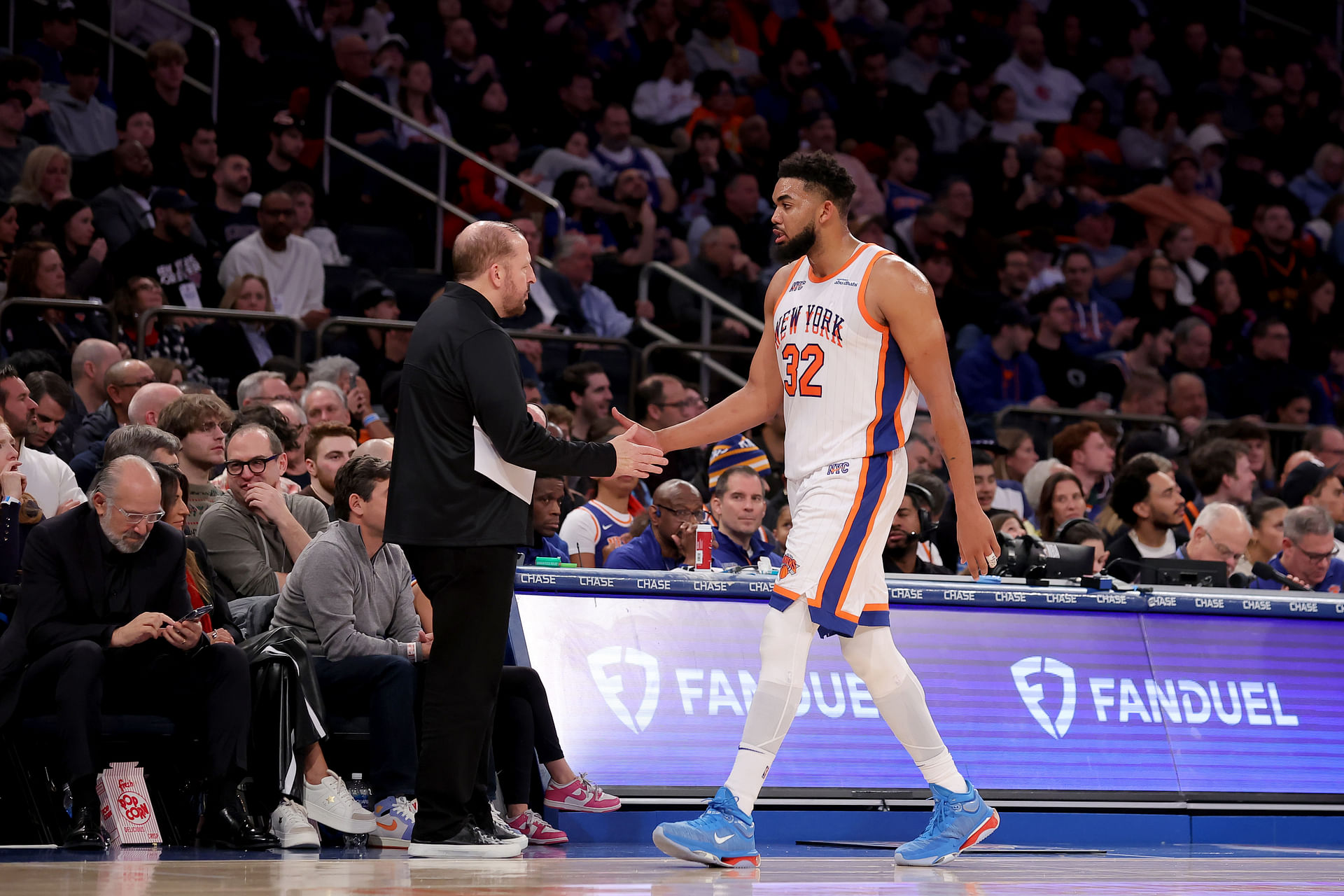 Jan 10, 2025; New York, New York, USA; New York Knicks center Karl-Anthony Towns (32) shakes hands with New York Knicks head coach Tom Thibodeau as he exits the game during the third quarter against the Oklahoma City Thunder at Madison Square Garden. Mandatory Credit: Brad Penner-Imagn Images - Source: Imagn