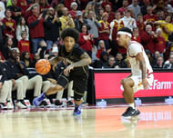 Iowa State Cyclones guard Tamin Lipsey (#3) defends the dribble of UCF Knights guard Mikey Williams (#1) during the second half at James H. Hilton Coliseum. Photo: Imagn