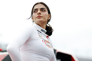 Toni Breidinger rocks crop top and jeans amid rain halting qualifying and practice