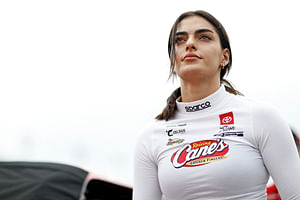 Toni Breidinger makes stylish speedway statement in Coach tank top and tan bottoms