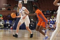 Video: Former LSU hooper Last-Tear Poa poses in sparkly tiger print dress after her graduation ceremony