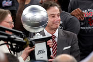 Big East Conference commissioner Val Ackerman (left) hands the championship trophy to St. John's Red Storm head coach Rick Pitino after they defeated the Creighton Bluejays. Photo: Imagn