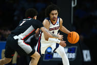 Gonzaga Bulldogs guard Ryan Nembhard (#0) dribbles against Georgia Bulldogs guard Dakota Leffew (#1) during their NCAA Tournament game at Intrust Bank Arena. Photo: Imagn