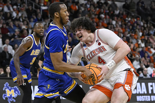 Clemson Tigers forward Ian Schieffelin (#4) tries to drive against McNeese State Cowboys guard Quadir Copeland (#11) during the first half at Amica Mutual Pavilion. Photo: Imagn