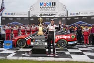 NASCAR Cup Series driver Denny Hamlin (11) and his crew celebrate the win during the Goodyear 400 at Darlington Raceway. Mandatory Credit: Jim Dedmon-Imagn Images