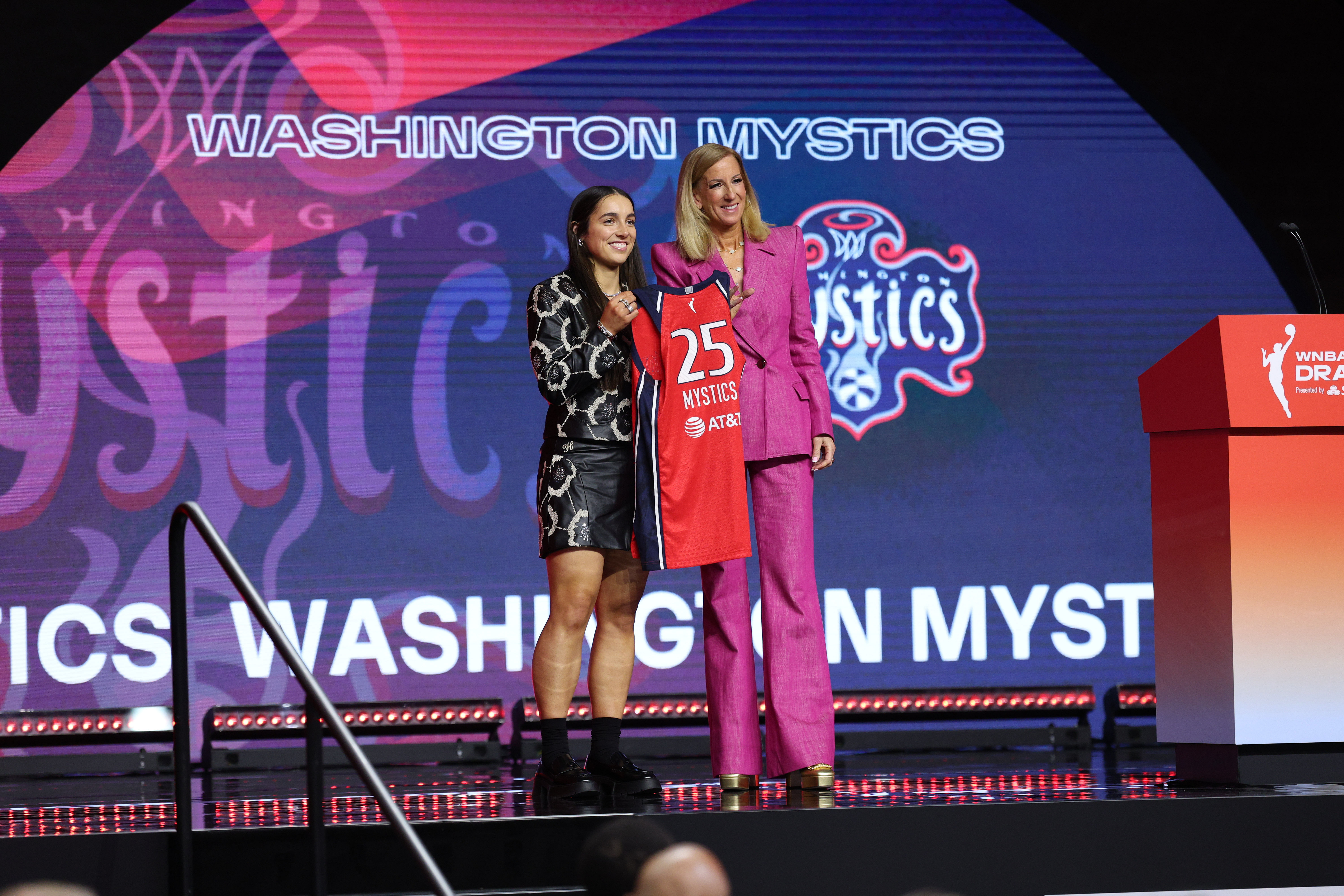 Apr 14, 2025; New York, New York, USA; Georgia Amoore poses with WNBA commissioner Cathy Engelbert after being selected with the number six overall pick to the Washington Mystics in the 2025 WNBA Draft at The Shed at Hudson Yards. Mandatory Credit: Vincent Carchietta-Imagn Images - Source: Imagn