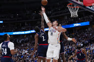 LA Clippers forward Kawhi Leonard (2) and Denver Nuggets center Nikola Jokic (15) reach for a rebound in the second half during game five of the first round for the 2025 NBA Playoffs at Ball Arena. Mandatory Credit: Ron Chenoy-Imagn Images - Source: Imagn