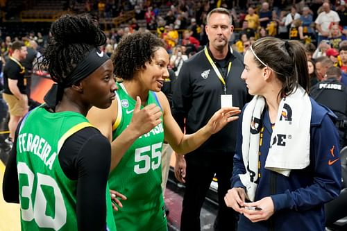 Indiana guard Caitlin Clark (#22) talks to members of the Brazilian National Team after the Fever defeated Brazil in a preseason game on May 4, 2025. Photo: Imagn