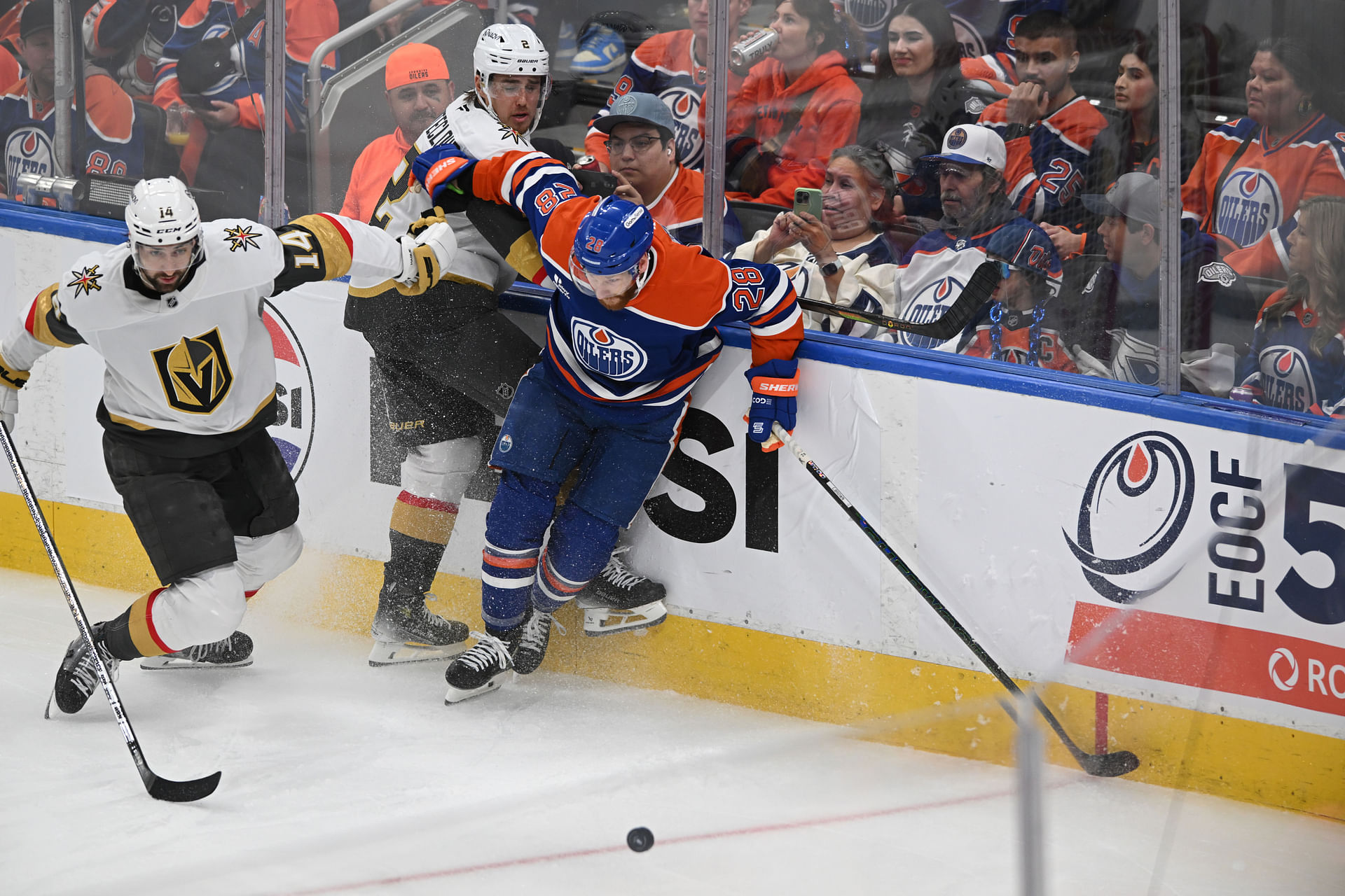 May 10, 2025; Edmonton, Alberta, CAN; Las Vegas Golden Knights defenceman Nicolas Hague (14) and Knights defenceman Zach Whitecloud (2) battle for the puck during the third period in game three of the second round of the 2025 Stanley Cup Playoffs at Rogers Place. Mandatory Credit: Walter Tychnowicz-Imagn Images - Source: Imagn