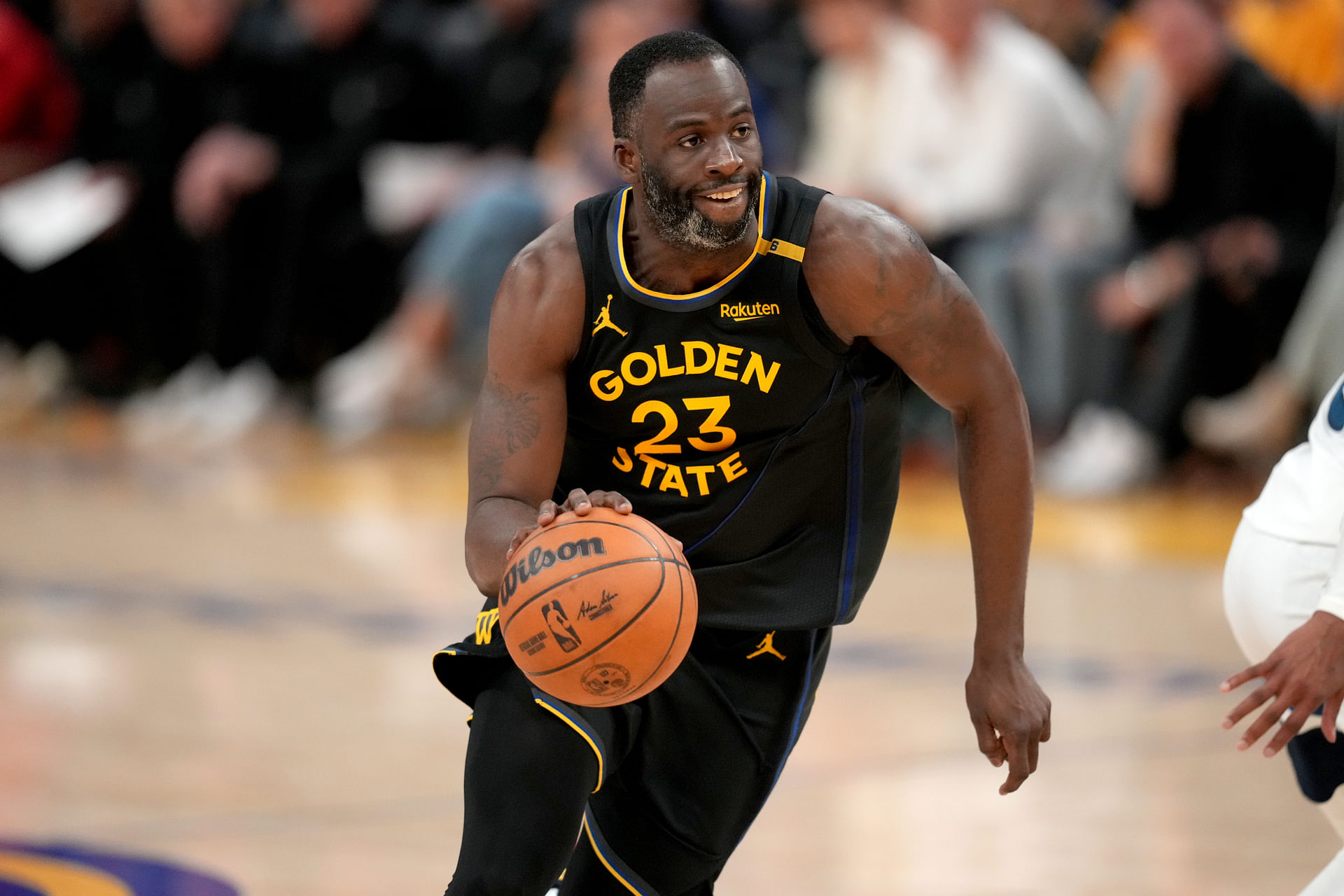 May 12, 2025; San Francisco, California, USA; Golden State Warriors forward Draymond Green (23) dribbles the ball against the Minnesota Timberwolves in the fourth quarter during game four of the second round for the 2025 NBA Playoffs at Chase Center. Mandatory Credit: Cary Edmondson-Imagn Images - Source: Imagn