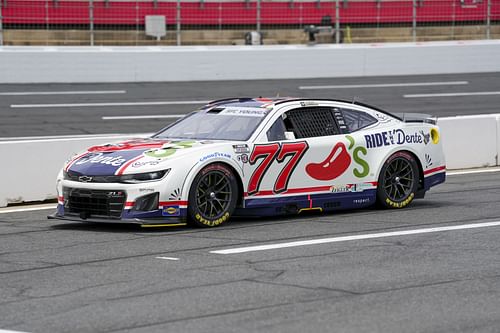 Carson Hocevar (77) during qualifying at Charlotte Motor Speedway. Credit: Jim Dedmon-Imagn