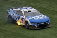 Kyle Larson (5) fires his car back up after a spin in turn four during the Coca-Cola 600 at Charlotte Motor Speedway. - Source: Imagn