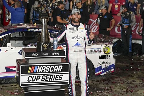 NASCAR Cup Series driver Ross Chastain (1) celebrates his win during the Coca Cola 600 at Charlotte Motor Speedway - Source: Imagn