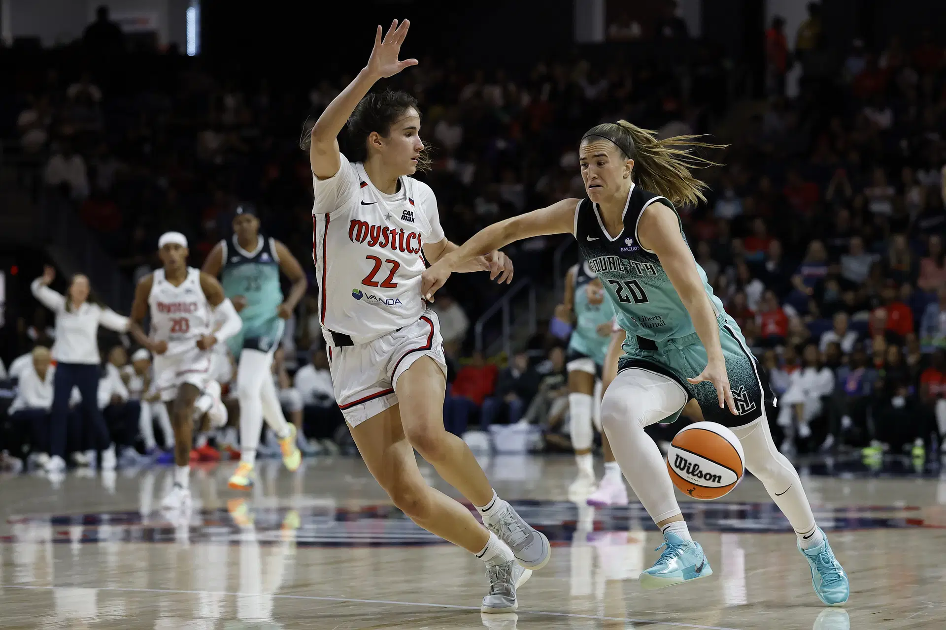 May 30, 2025; Washington, District of Columbia, USA; New York Liberty guard Sabrina Ionescu (20) drives to the basket as Washington Mystics guard Sonia Citron (22) defends in the first half at CareFirst Arena. Mandatory Credit: Geoff Burke-Imagn Images - Source: Imagn