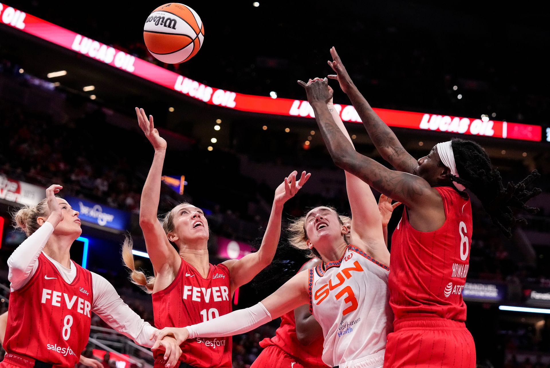 Indiana Fever guard Lexie Hull (10). Indiana Fever forward Natasha Howard (6) and Indiana Fever guard Sophie Cunningham (8) go in for a rebound against Connecticut Sun guard Marina Mabrey (3) on Friday, May 30, 2025, during the game at Gainbridge Fieldhouse in Indianapolis. The Connecticut Sun defeated the Indiana Fever, 85-83. - Source: Imagn