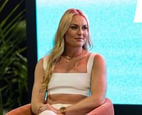Lindsey Vonn sports Gucci bag in all white business casual outfit