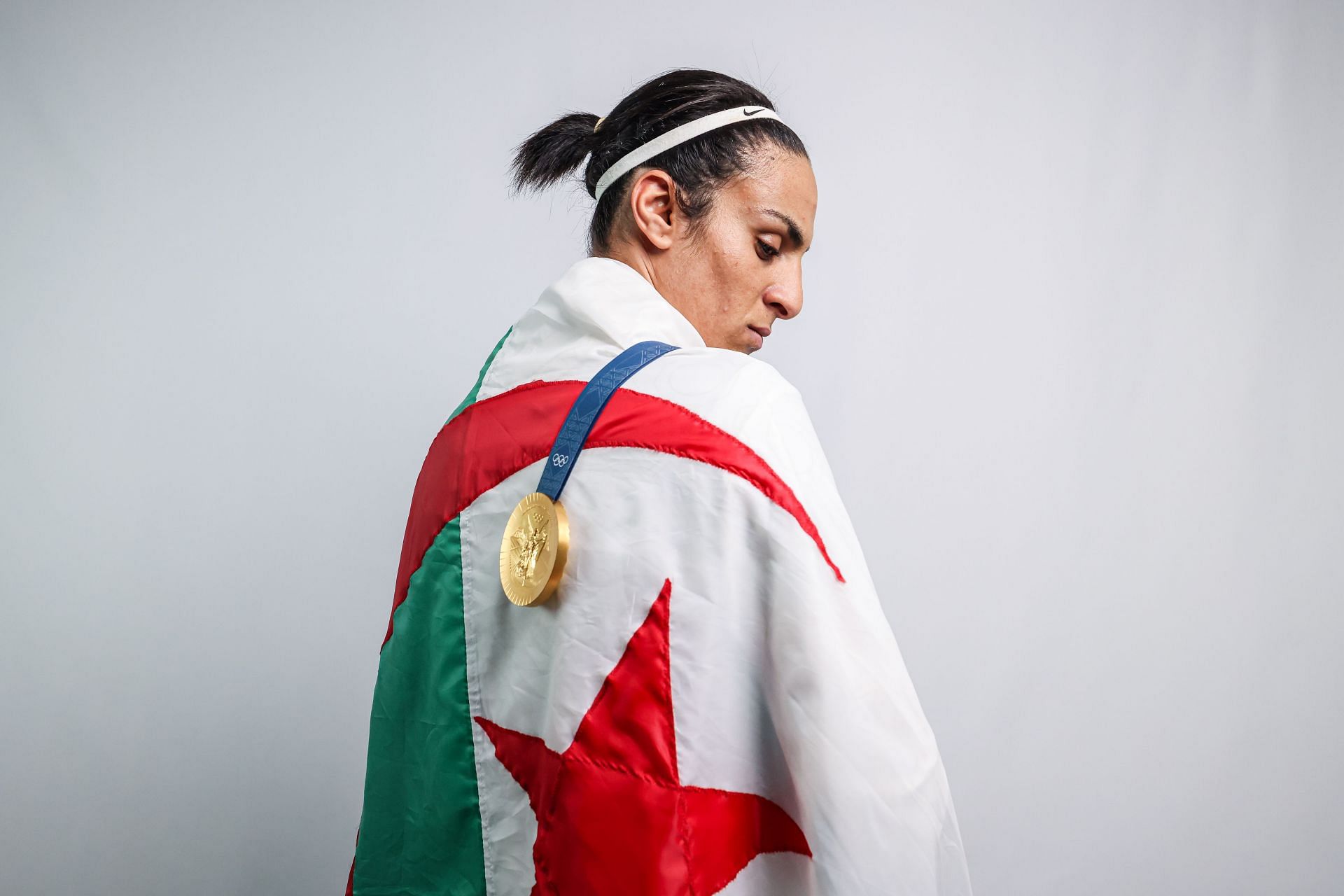 Imane Khelif with her gold medal at a Paris 2024 photoshoot - Source: Getty