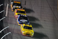Clint Bowyer (33) leads Kurt Busch (2), Kevin Harvick (29), and Jeff Burton (31) during the 2010 Coke Zero 400. Source: Imagn