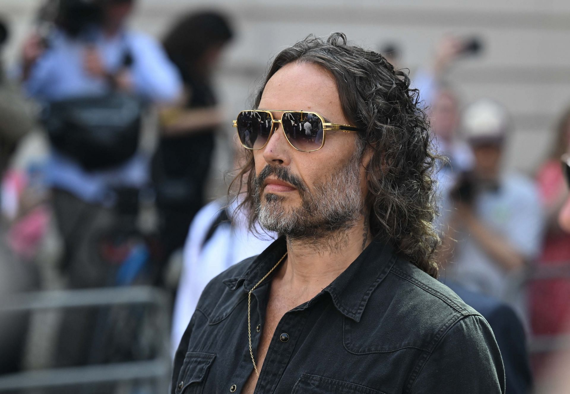 Russel Brand appears at court in London on rape and assault charges - Source: Getty
