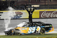 Carl Edwards (99) celebrates after winning the NASCAR All-Star Race in 2011 - Source: Imagn