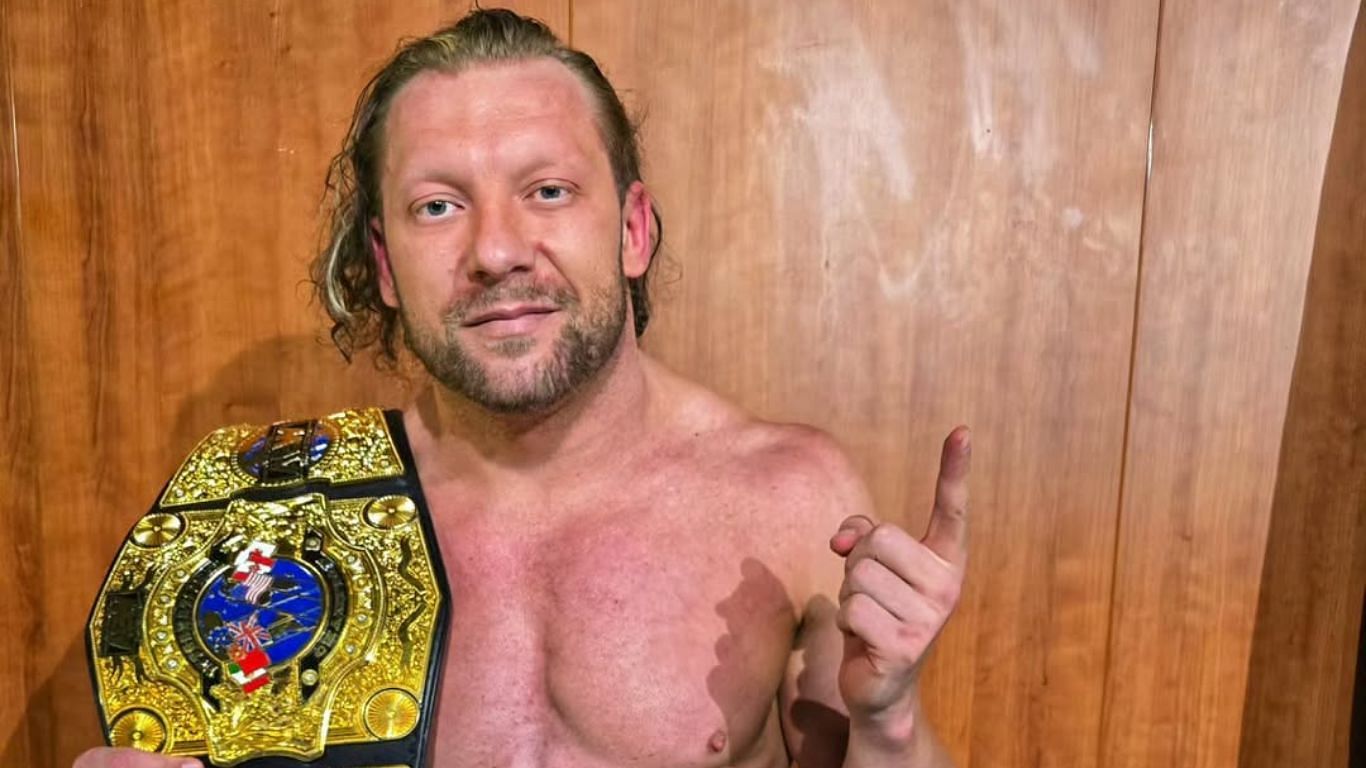 Kenny Omega posing with his AEW International Title [ Image from Omega
